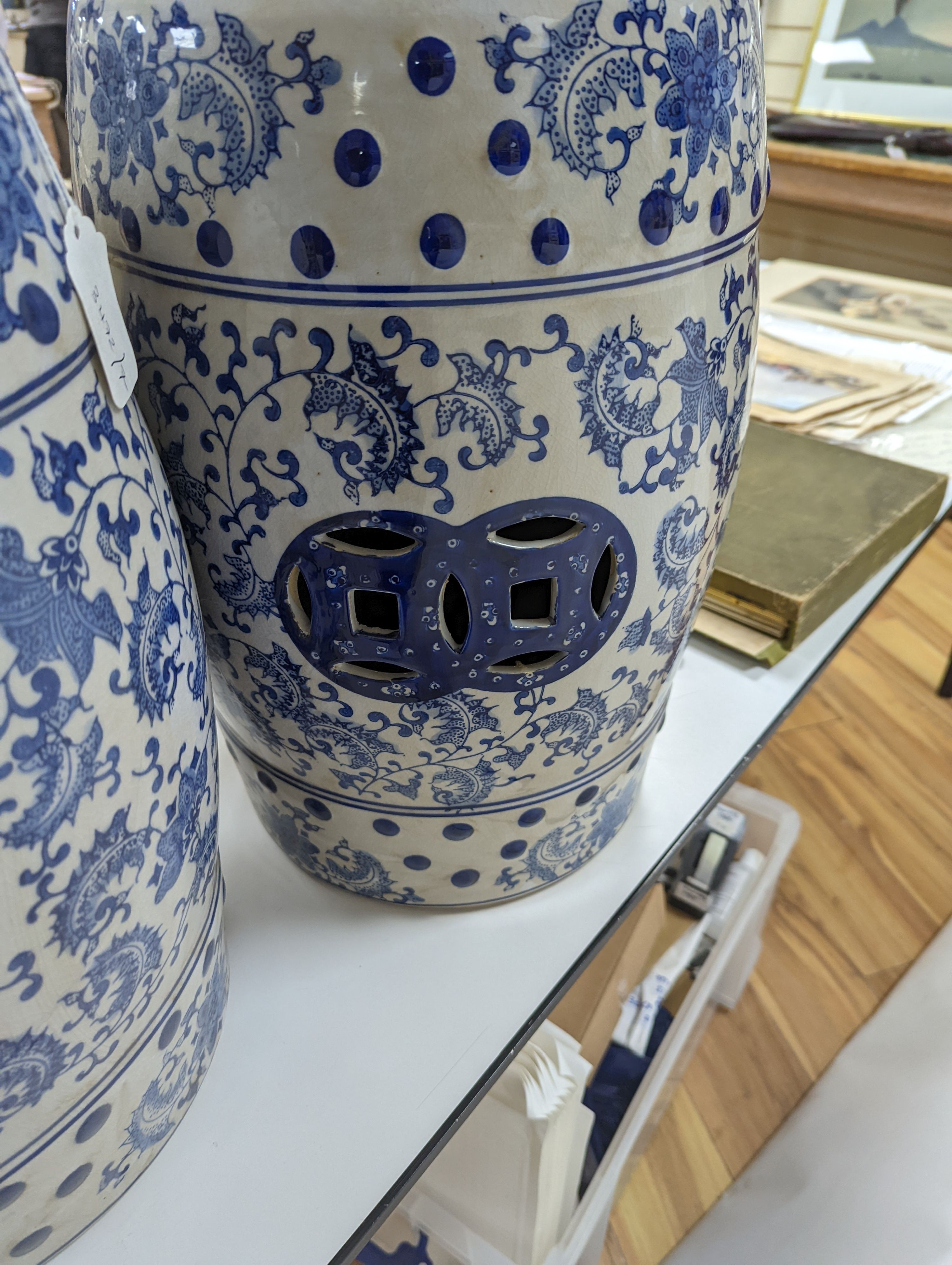 A pair of Chinese blue and white garden seats, 44 cms high.